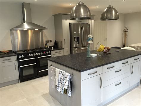 grey cabinets with cisland cook top steel knobs|grey kitchen cabinets.